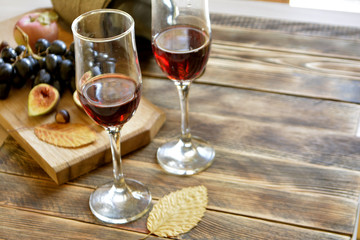 the wine, the figs, the grapes on the table copy space