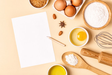 Ingredients and utensils for baking on a pastel background.