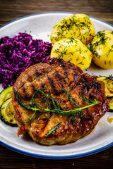 Grilled steak with potatoes and vegetables