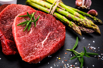 Fresh raw beef steaks on white background