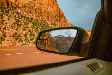 View of mountains on car side mirrors