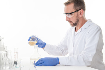 man in the laboratory
view of a man in the laboratory while performing experiments
