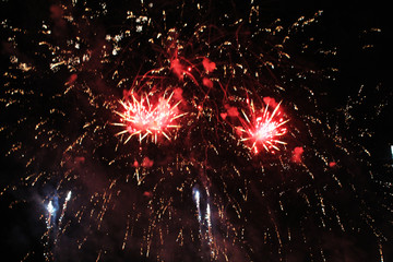  Fireworks. Salute. Sky background Colorful wave of bright twinkling red and blue sparkling lights...