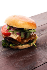 Tasty fresh meat burgers with salad and cheese. Homemade angus burger.
