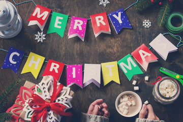 Merry Christmas background, xmas gift box, branch of a Christmas tree and decorations on rustic...