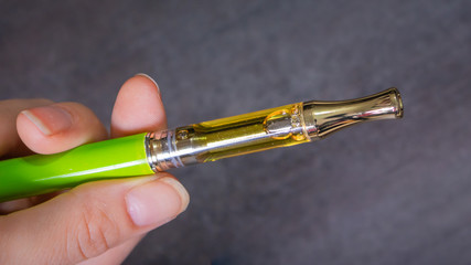 A gram of potent THC oil in a cartridge for vaping