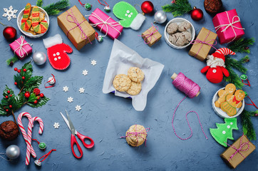 Fototapeta na wymiar Christmas background with gifts, cookies, Christmas decoration and christmas balls