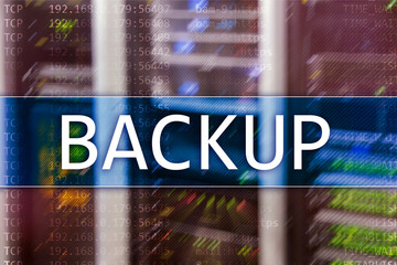 Backup button on modern server room background. Data loss prevention. System recovery.