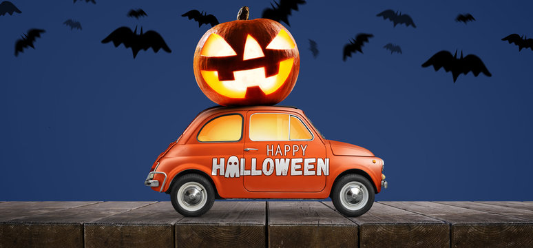 Halloween Car Delivering Pumpkin Against Blue Background