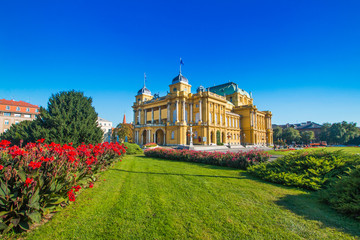    Croatian national theater building and flowers in park in Zagreb, Croatia 