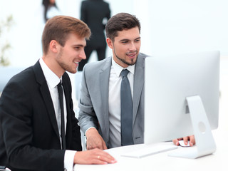 employees are talking sitting behind a Desk