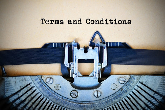 Drafting terms and conditions of an agreement using a retro typewriter 

