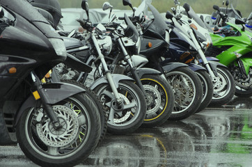 motorcycles standing in the row on asphalt closeup
