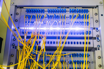 Equipment for high-speed access to the Internet. Fiber-optic wires are connected to the Optical...
