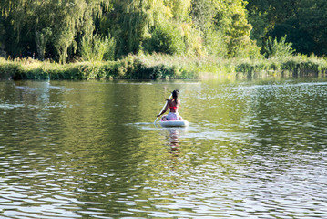 Fototapeta na wymiar Kayaking in green lake