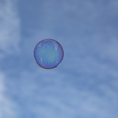 soapbubbles flying in the  sky