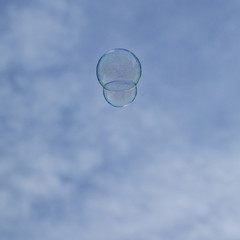 soapbubbles flying in the  sky