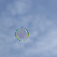 soapbubbles flying in the  sky