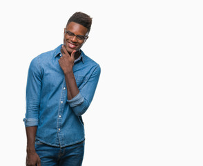 Young african american man over isolated background looking confident at the camera with smile with crossed arms and hand raised on chin. Thinking positive.