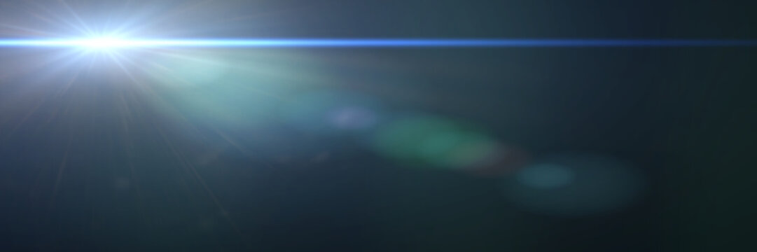 beautiful blue lens flare effect overlay texture with bokeh effect and anamorphic light streak in front of a black background, banner format