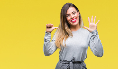 Young beautiful worker business woman over isolated background showing and pointing up with fingers number six while smiling confident and happy.