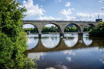 Fototapeta na wymiar Stone Arch Bridge in downtown Minneapolis Minnesota, as seen from St. Anthony Main