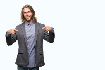 Young handsome business man with long hair over isolated background looking confident with smile on...