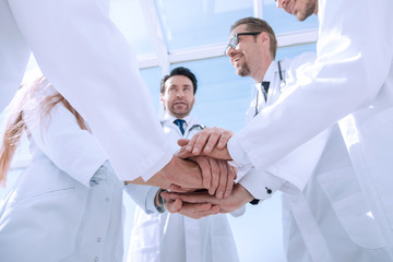 bottom view. close up of a doctors folded their hands together