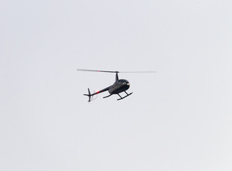 Helicopter Flies By in the Sky