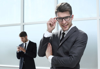 Happy business team on office background