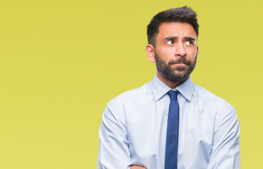 Adult hispanic business man over isolated background smiling looking side and staring away thinking.