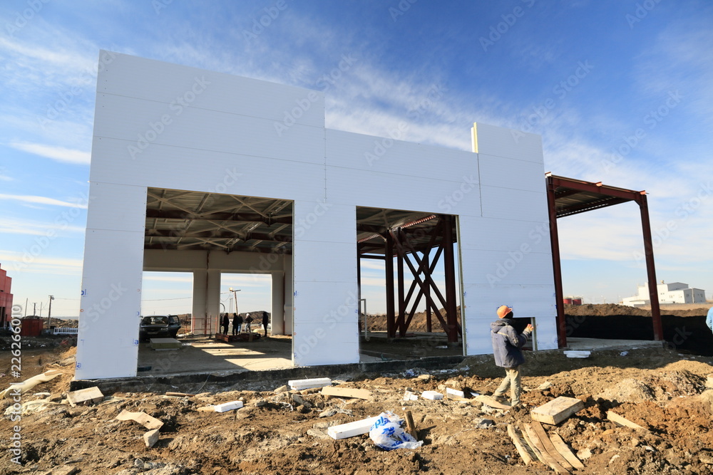 Wall mural the process of construction and launch of a large logistics center, its internal filling and finishi