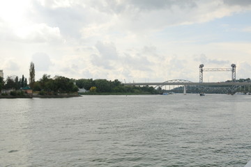 Embankment of the don river before the rain, heavy clouds come from the East. quay of the river the storm the people