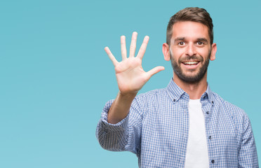 Young handsome man wearing white t-shirt over isolated background showing and pointing up with...