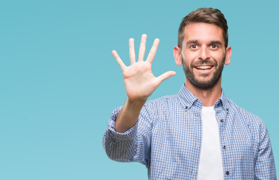 Young handsome man wearing white t-shirt over isolated background showing and pointing up with fingers number five while smiling confident and happy.