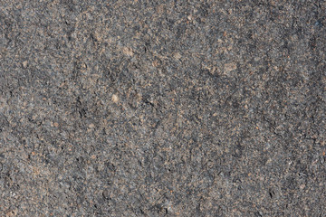 Gray volcanic sand, small stone surface. Detailed natural background or texture