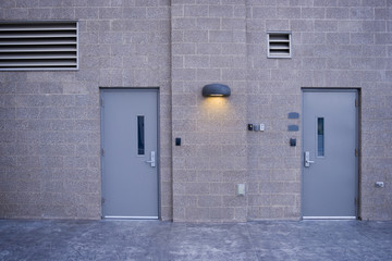 Obraz na płótnie Canvas Industrial facility wall with secure doors