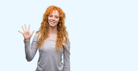 Young redhead woman showing and pointing up with fingers number five while smiling confident and happy.