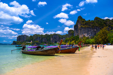 Fototapeta na wymiar Long tail boats and rocks on Railay beach west, Ao Nang, Krabi,