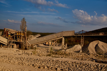 abandoned building and mountains of sand