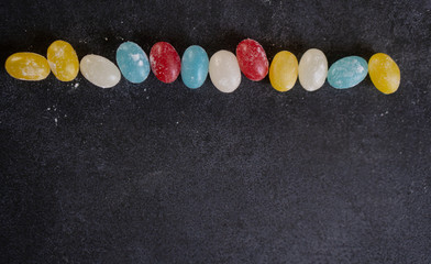 Colorful mixed tasty candies on a background