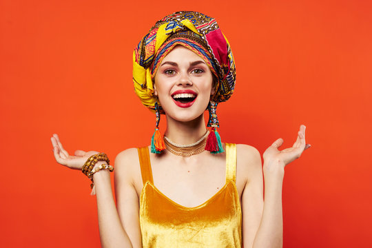 Happy Woman With Turban Spreads Her Arms To The Side