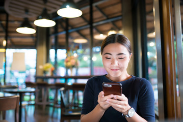 Woman use smartphone at cafe
