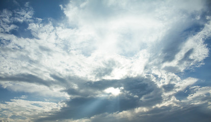 light rays on dramatic moody blue sky