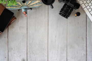 Top view shot of desk photographer workplace with keyboard computer and copy space.
