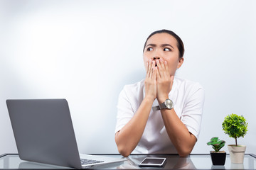 Woman scare something on laptop