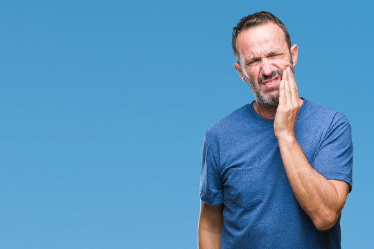 Middle Age Hoary Senior Man Over Isolated Background Touching Mouth With Hand With Painful Expression Because Of Toothache Or Dental Illness On Teeth. Dentist Concept.