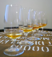 Shizuoka,Japan-October 6, 2018: Varieties of Japanese whisky in tasting glasses on a whisky barrel