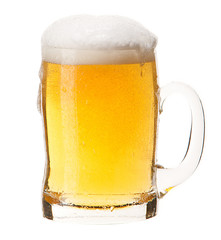 Cold mug of light beer with foam isolated on white background.