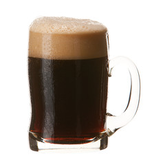 Cold mug of dark beer with foam isolated on white background.